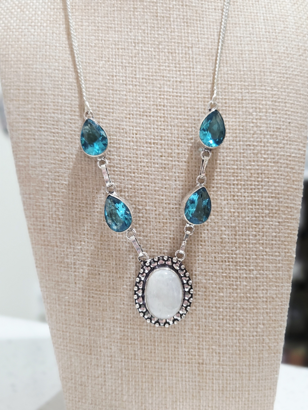 Silver Necklace with Blue Topaz Teardrop Stones and Oval Moonstone Pendant